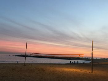 Scenic view of beach against sky during sunset
