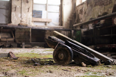 Damaged push cart in abandoned room