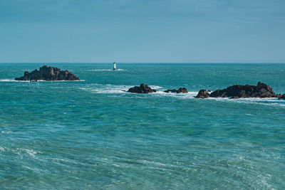 Scenic view of sea against blue sky