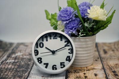 Close-up of purple flower vase on table