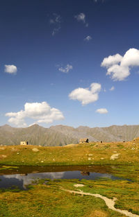 Scenic view of field against sky