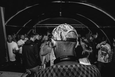 Rear view of people dancing at nightclub