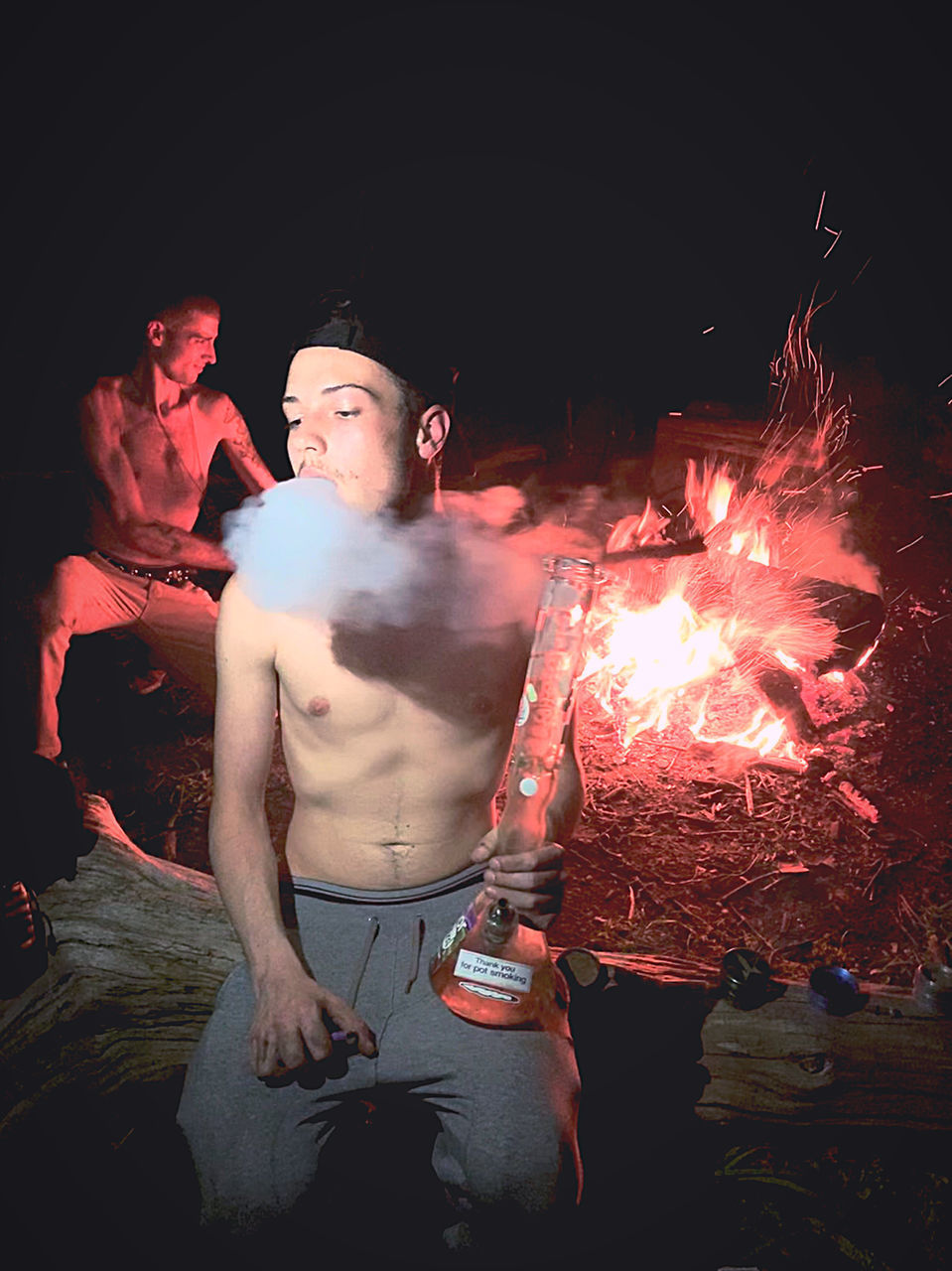 YOUNG MAN WITH FIRE CRACKERS AT NIGHT DURING FESTIVAL