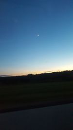 Scenic view of silhouette landscape against clear sky during sunset