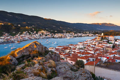 High angle view of townscape by sea against sky