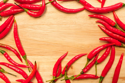 Close-up of red chili peppers on table