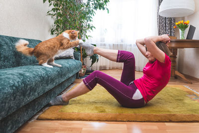 Woman lying on floor at home