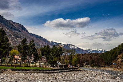 Scenic view of landscape and mountains against sky