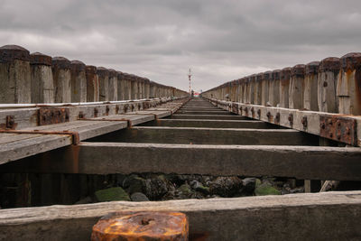 Surface level of bridge against sky