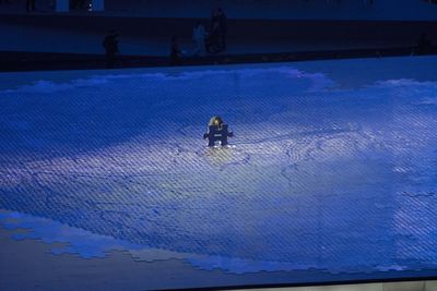 Full length of woman on snow against sky