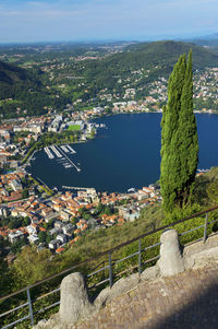 High angle view of built structures against calm lake