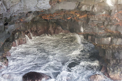 Scenic view of sea and cave