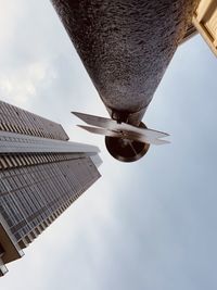 Low angle view of skyscraper against sky