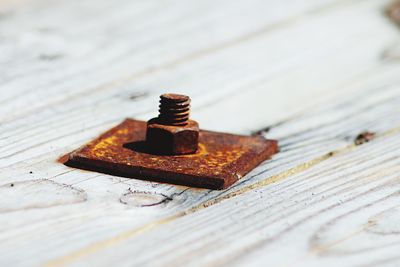 Close-up of rusty metal on table