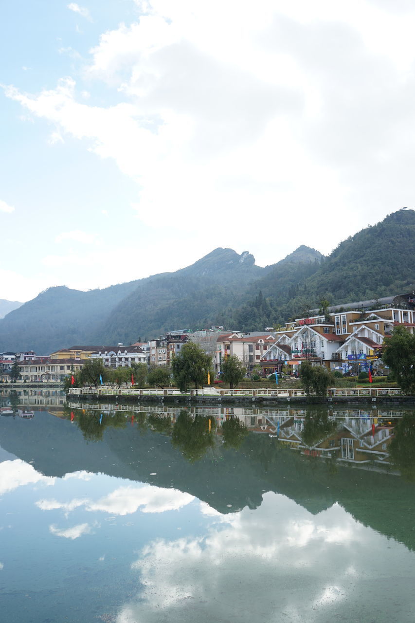 TOWN BY LAKE AGAINST SKY