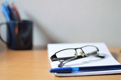 Close-up of pen on table