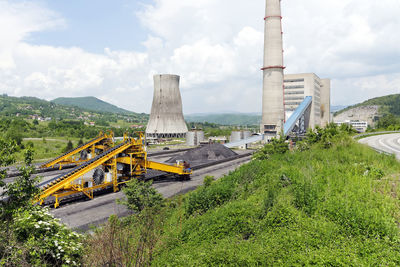 Panoramic view of bridge over road against sky