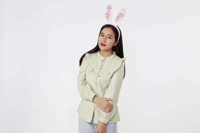 Portrait of a teenage girl against white background