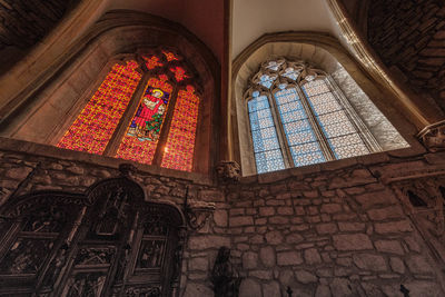 Low angle view of glass window in building