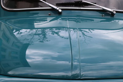 Close-up of car on sea against sky