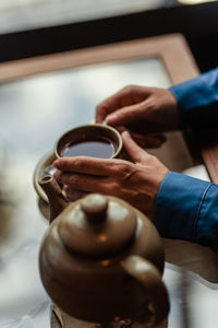 Woman's hands holding coffee