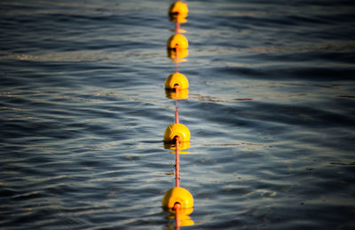 Close-up of buoy floating on sea