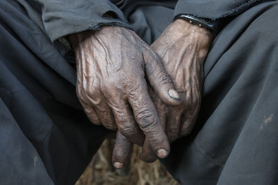 Midsection of man with messy hands