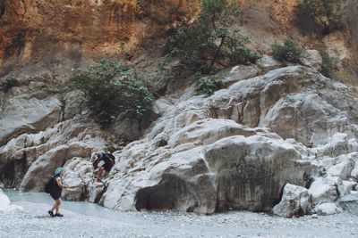 Hikers by rock formation at saklikent