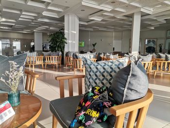 Empty chairs and tables in restaurant