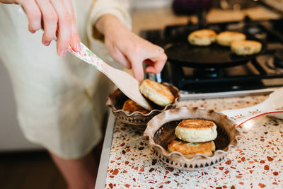 Midsection of woman preparing food