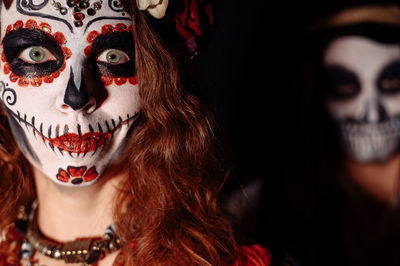 Close-up of young woman wearing mask