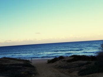 Scenic view of sea against clear sky during sunset