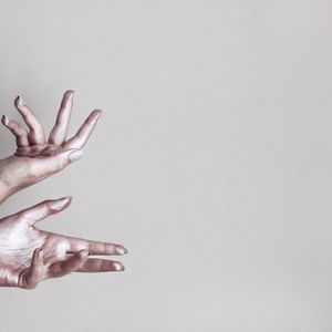 Close-up of hand against white background