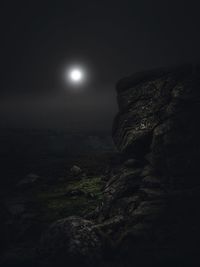 Scenic view of rock formation at night