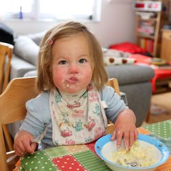 Cute girl sitting at table