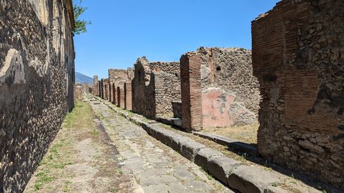 Low angle view of old ruins against sky
