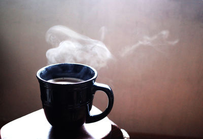 Close-up of coffee cup on table