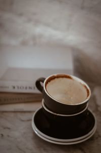 Close-up of coffee cup on table