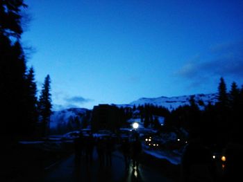 Silhouette of people at dusk during winter