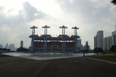 View of city buildings against cloudy sky