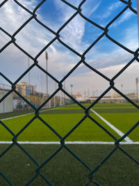 Full frame shot of chainlink fence against sky