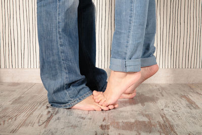 Low section of people on tiled floor