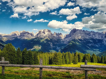 Scenic view of trees and mountains against sky in italy