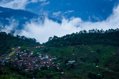 Scenic view of farms against sky