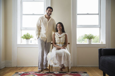 Portrait of smiling couple at home