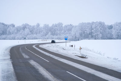 Empty road against clear sky