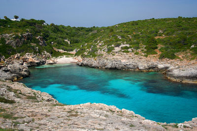 Scenic view of sea with mountain in background