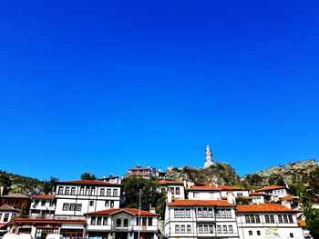 Low angle view of buildings against blue sky