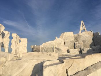 Low angle view of rocks against sky