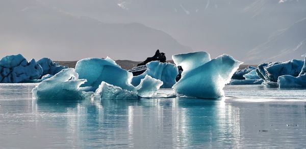 Scenic view of frozen sea against sky